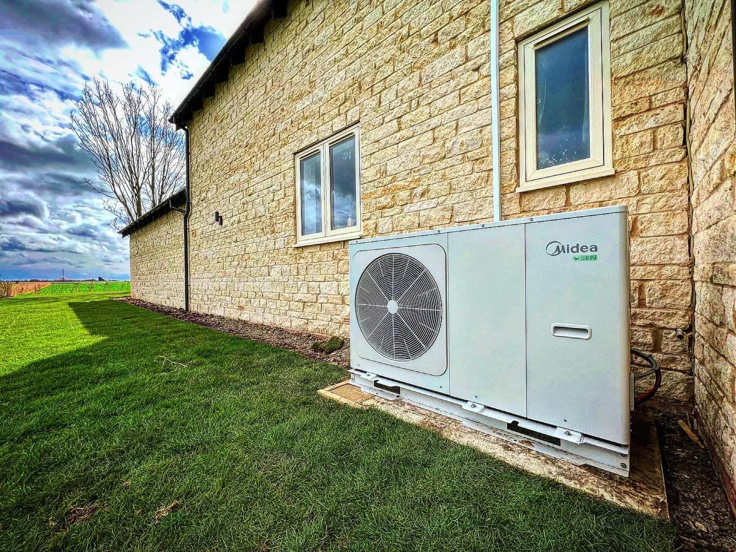 air source heat pump on side of building